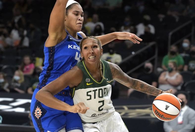 Aug 12, 2021; Phoenix, Arizona, USA; Seattle Storm center Mercedes Russell (2) drives against Connecticut Sun forward Brionna Jones (42) in the first half during the Inaugural WNBA Commissioners Cup Championship Game at Footprint Center. Mandatory Credit: Rick Scuteri-USA TODAY Sports