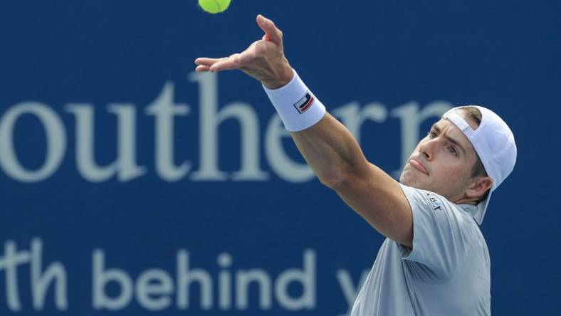 Aug 17, 2021; Mason, OH, USA; John Isner (USA) serves the ball against Cameron Norrie (GBR) during the Western and Southern Open tennis tournament at Lindner Family Tennis Center. Mandatory Credit: Aaron Doster-USA TODAY Sports