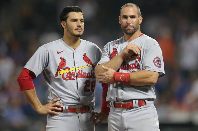 Sep 14, 2021; New York City, New York, USA; St. Louis Cardinals third baseman Nolan Arenado (28) talks to first baseman Paul Goldschmidt (46) after being stranded on the bases against the New York Mets in the top of the tenth inning at Citi Field. Mandatory Credit: Brad Penner-USA TODAY Sports