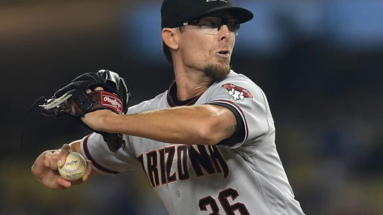 Sep 14, 2021; Los Angeles, California, USA;  Arizona Diamondbacks relief pitcher Tyler Clippard (36) throws a scoreless eighth inning against the Los Angeles Dodgers at Dodger Stadium. Mandatory Credit: Jayne Kamin-Oncea-USA TODAY Sports