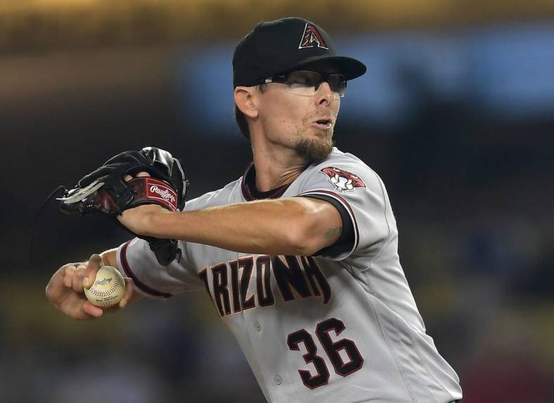 Sep 14, 2021; Los Angeles, California, USA;  Arizona Diamondbacks relief pitcher Tyler Clippard (36) throws a scoreless eighth inning against the Los Angeles Dodgers at Dodger Stadium. Mandatory Credit: Jayne Kamin-Oncea-USA TODAY Sports