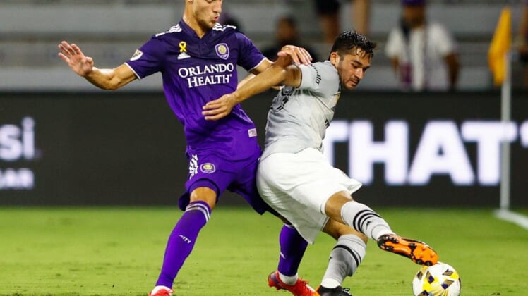 Sep 15, 2021; Orlando, Florida, USA;  CF Montreal midfielder Mathieu Choiniere (29) controls the ball against Orlando City forward Silvester van der Water (14) in the first half at Orlando City Stadium. Mandatory Credit: Nathan Ray Seebeck-USA TODAY Sports
