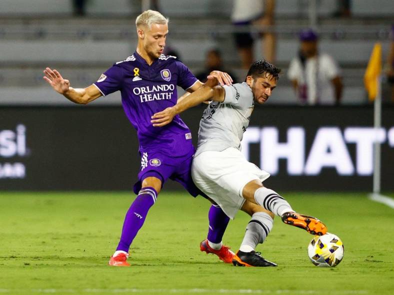 Sep 15, 2021; Orlando, Florida, USA;  CF Montreal midfielder Mathieu Choiniere (29) controls the ball against Orlando City forward Silvester van der Water (14) in the first half at Orlando City Stadium. Mandatory Credit: Nathan Ray Seebeck-USA TODAY Sports
