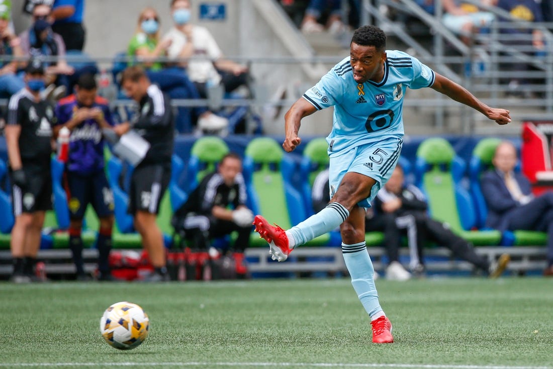 Sep 11, 2021; Seattle, Washington, USA; Minnesota United FC midfielder Jacori Hayes (5) attempts a shot against the Seattle Sounders FC during the second half at CenturyLink Field. Mandatory Credit: Joe Nicholson-USA TODAY Sports