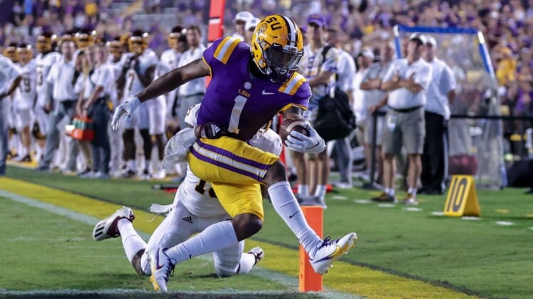 Sep 18, 2021; Baton Rouge, Louisiana, USA;  LSU Tigers wide receiver Kayshon Boutte (1) makes a 2 yard touchdown reception against Central Michigan Chippewas defensive back Donte Kent (19) during the first half at Tiger Stadium. Mandatory Credit: Stephen Lew-USA TODAY Sports
