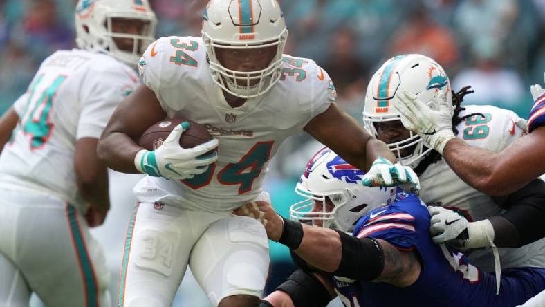 Sep 19, 2021; Miami Gardens, Florida, USA; Miami Dolphins running back Malcolm Brown (34) runs the ball against the Buffalo Bills during the first half at Hard Rock Stadium. Mandatory Credit: Jasen Vinlove-USA TODAY Sports