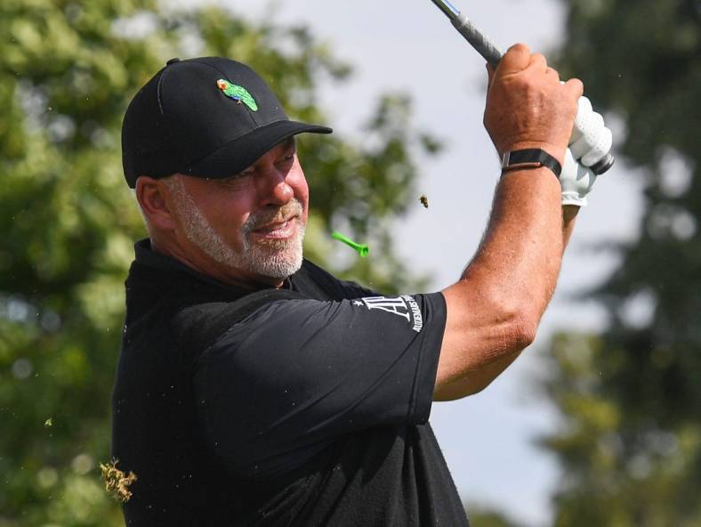 The tee kicks up near Darren Clarke's face as he tees off on the last day of the Sanford International golf tournament on Sunday, September 19, 2021, at the Minnehaha Country Club in Sioux Falls.

Sanford International Finals 005