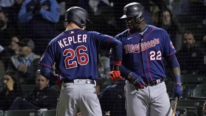 Sep 22, 2021; Chicago, Illinois, USA; Minnesota Twins left fielder Max Kepler (26) is greeted by first baseman Miguel Sano (22) after hitting a home run against the Chicago Cubs during the fourth inning at Wrigley Field. Mandatory Credit: David Banks-USA TODAY Sports