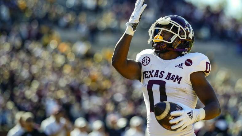 Oct 16, 2021; Columbia, Missouri, USA; Texas A&M Aggies wide receiver Ainias Smith (0) celebrates after scoring a touchdown against the Missouri Tigers during the first half at Faurot Field at Memorial Stadium. Mandatory Credit: Jay Biggerstaff-USA TODAY Sports