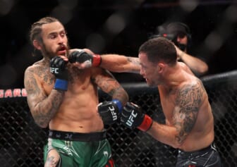 Nov 6, 2021; New York, NY, USA; Marlon Vera (blue gloves) competes against Frankie Edgar (red gloves) during UFC 268 at Madison Square Garden. Mandatory Credit: Ed Mulholland-USA TODAY Sports