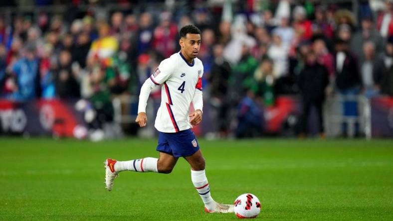 Tyler Adams #4 of the United States maintains possession during the first half of a 2022 World Cup CONCACAF qualifying match against Mexico, Friday, Nov. 12, 2021, at TQL Stadium in Cincinnati. United States won against Mexico, 2-0.

Mexico At Usa 2022 World Cup Qualifier Nov 11