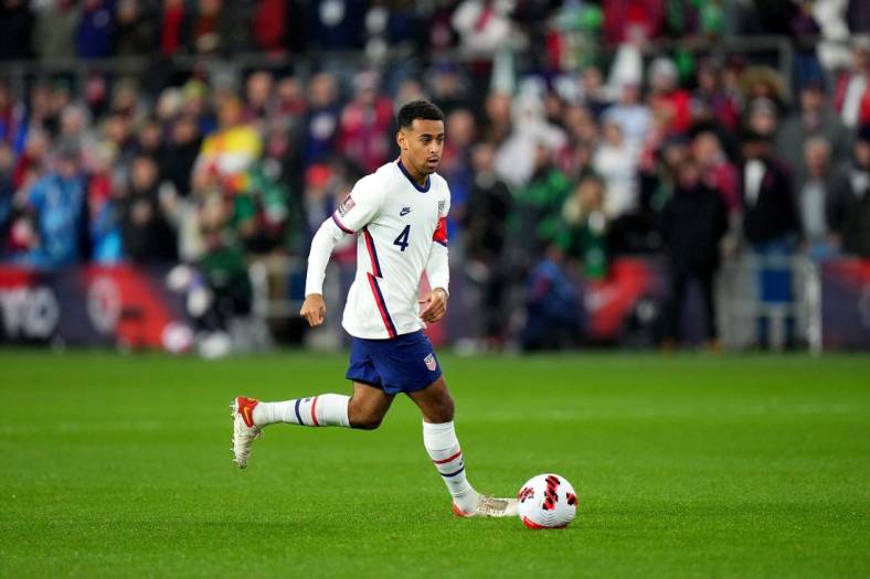 Tyler Adams #4 of the United States maintains possession during the first half of a 2022 World Cup CONCACAF qualifying match against Mexico, Friday, Nov. 12, 2021, at TQL Stadium in Cincinnati. United States won against Mexico, 2-0.

Mexico At Usa 2022 World Cup Qualifier Nov 11