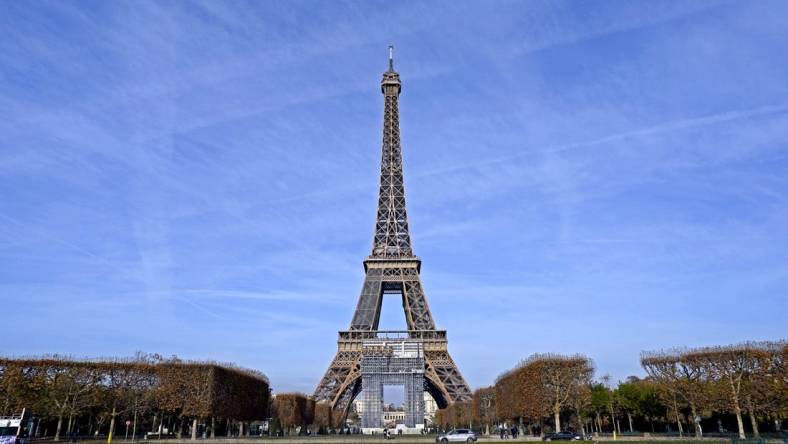 Nov 198, 2021; Paris, France; A view of the Eiffel Tower from the Champ de Mars which will server as the venue for beach volleyball during the Paris 2024 Olympics. Mandatory Credit: Peter Casey-USA TODAY Sports