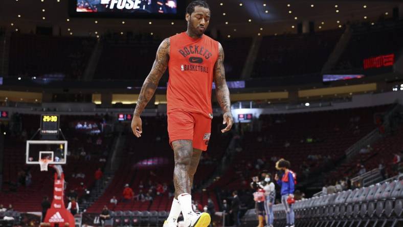 Nov 24, 2021; Houston, Texas, USA; Houston Rockets guard John Wall (1) walks on the court before the game against the Chicago Bulls at Toyota Center. Mandatory Credit: Troy Taormina-USA TODAY Sports