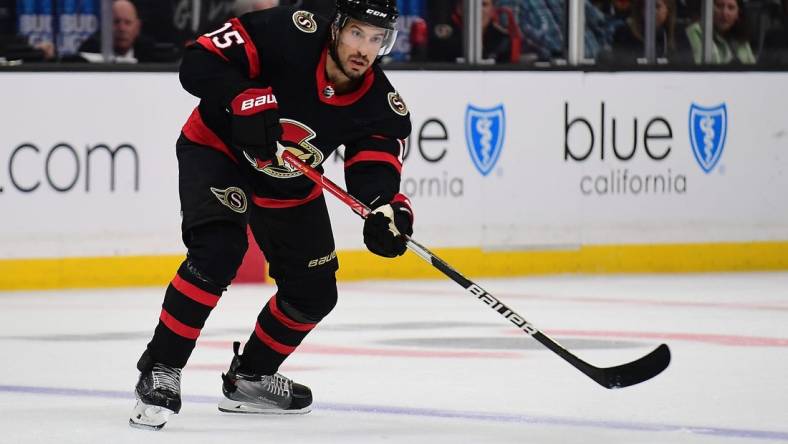 Nov 27, 2021; Los Angeles, California, USA; Ottawa Senators defenseman Michael Del Zotto (15) passes the puck against the Los Angeles Kings during the third period at Staples Center. Mandatory Credit: Gary A. Vasquez-USA TODAY Sports