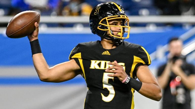 Detroit King's Dante Moore throws a pass against DeWitt during the third quarter on Saturday, Nov. 27, 2021, at Ford Field in Detroit.

211127 Dewitt Detroit King 069a