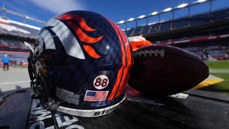 Dec 12, 2021; Denver, Colorado, USA; Detailed view of a memorial sticker on a Denver Broncos helmet in reference to American football player Demaryius Thomas before the game against the Detroit Lions at Empower Field at Mile High. Mandatory Credit: Ron Chenoy-USA TODAY Sports