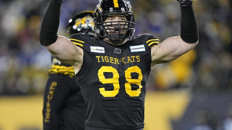 Dec 12, 2021; Hamilton, Ontario, CAN; Hamilton Tiger-Cats defensive tackle Dylan Wynn (98) gets the fans to cheer during the 108th Grey Cup football game against the Winnipeg Blue Bombers at Tim Hortons Field. Mandatory Credit: John E. Sokolowski-USA TODAY Sports