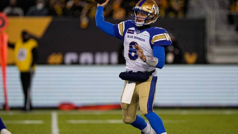 Dec 12, 2021; Hamilton, Ontario, CAN; Winnipeg Blue Bombers quarterback Zach Collaros (8) throws a pass against the Hamilton Tiger-Cats during the 108th Grey Cup football game at Tim Hortons Field. Mandatory Credit: John E. Sokolowski-USA TODAY Sports