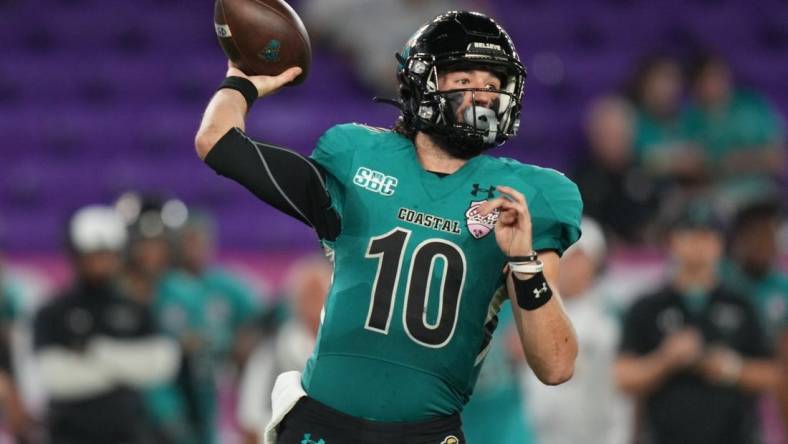 Dec 17, 2021; Orlando, Florida, USA; Coastal Carolina Chanticleers quarterback Grayson McCall (10) attempts a pass against the Northern Illinois Huskies during the second half of the 2021 Cure Bowl game at Exploria Stadium. Mandatory Credit: Jasen Vinlove-USA TODAY Sports