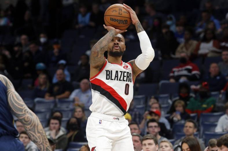 Dec 19, 2021; Memphis, Tennessee, USA; Portland Trail Blazers guard Damian Lillard (0) shoots for three during the first half against the Memphis Grizzles at FedExForum. Mandatory Credit: Petre Thomas-USA TODAY Sports