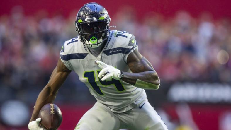 Jan 9, 2022; Glendale, Arizona, USA; Seattle Seahawks wide receiver DK Metcalf (14) against the Arizona Cardinals at State Farm Stadium. Mandatory Credit: Mark J. Rebilas-USA TODAY Sports