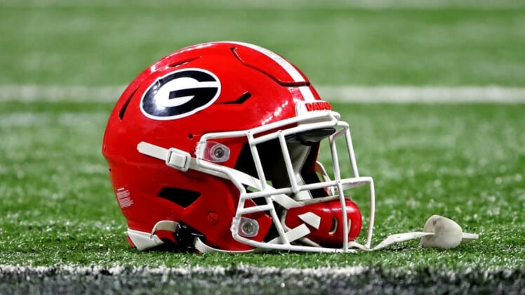 Jan 10, 2022; Indianapolis, IN, USA; A Georgia Bulldogs helmet sits on the field after the Georgia Bulldogs beat the Alabama Crimson Tide in the 2022 CFP college football national championship game at Lucas Oil Stadium. Mandatory Credit: Trevor Ruszkowski-USA TODAY Sports