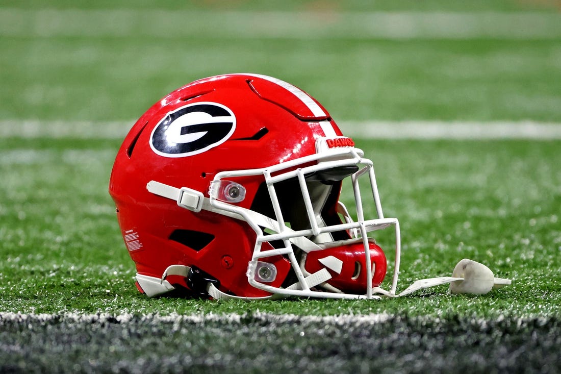 Jan 10, 2022; Indianapolis, IN, USA; A Georgia Bulldogs helmet sits on the field after the Georgia Bulldogs beat the Alabama Crimson Tide in the 2022 CFP college football national championship game at Lucas Oil Stadium. Mandatory Credit: Trevor Ruszkowski-USA TODAY Sports