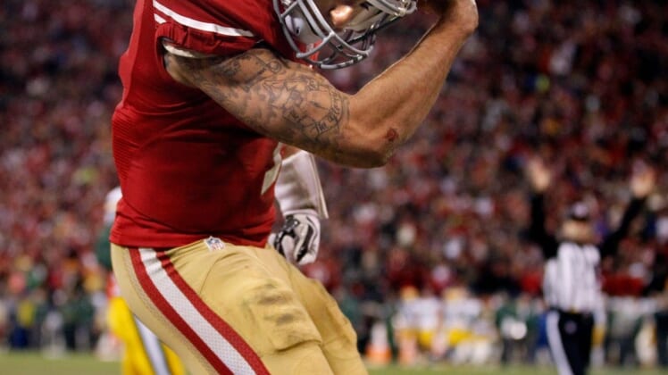San Francisco 49ers quarterback Colin Kaepernick (7) flexes his muscles after scoring a touchdown during their 45-31 victory over Green Bay Packers in their NFC Divisional playoff game Saturday, January 11, 2013 at Candlestick Park in San Francisco, Calif.Packers13 14 Spt Wood