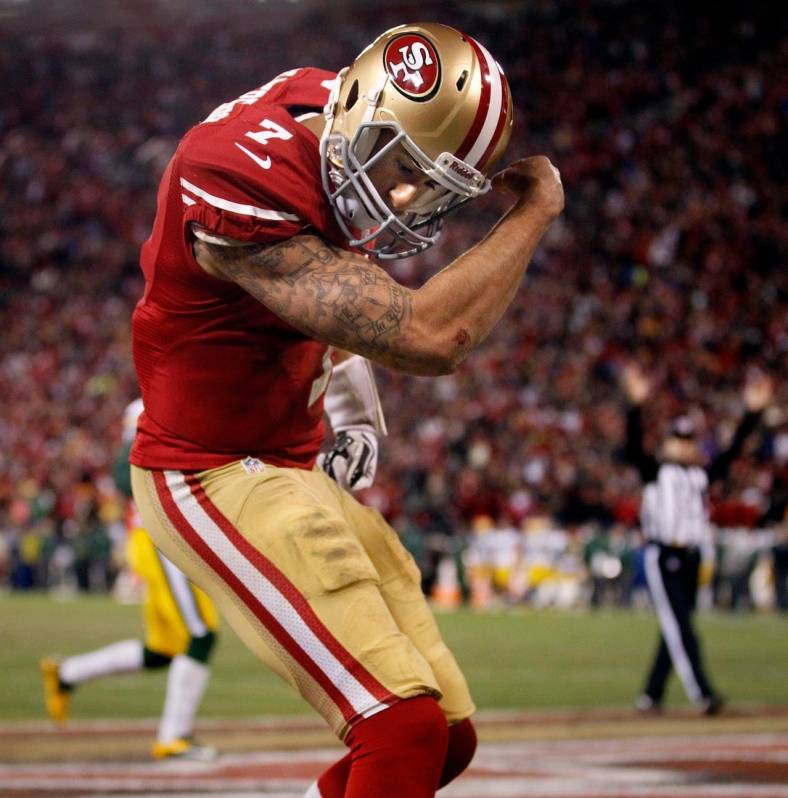 San Francisco 49ers quarterback Colin Kaepernick (7) flexes his muscles after scoring a touchdown during their 45-31 victory over Green Bay Packers in their NFC Divisional playoff game Saturday, January 11, 2013 at Candlestick Park in San Francisco, Calif.

Packers13 14 Spt Wood