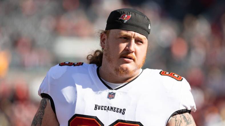 Jan 23, 2022; Tampa, Florida, USA; Tampa Bay Buccaneers center Ryan Jensen (66) warms up before the game against the Los Angeles Rams during a NFC Divisional playoff football game at Raymond James Stadium. Mandatory Credit: Matt Pendleton-USA TODAY Sports