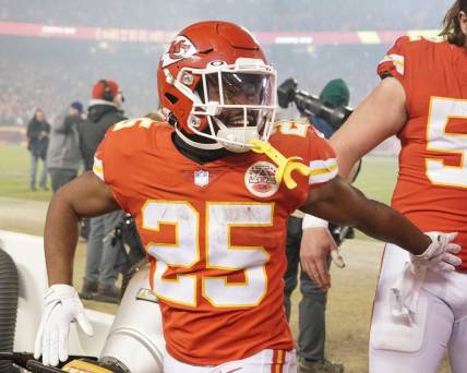 Jan 23, 2022; Kansas City, Missouri, USA; Kansas City Chiefs running back Clyde Edwards-Helaire (25) celebrates while leaving the field after the win over the Buffalo Bills during an AFC Divisional playoff football game at GEHA Field at Arrowhead Stadium. Mandatory Credit: Denny Medley-USA TODAY Sports