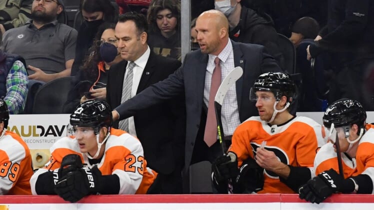 Feb 1, 2022; Philadelphia, Pennsylvania, USA; Philadelphia Flyers assistant head coach John Torchetti and interim head coach Mike Yeo behind the bench during the third period against the Winnipeg Jets at Wells Fargo Center. Mandatory Credit: Eric Hartline-USA TODAY Sports