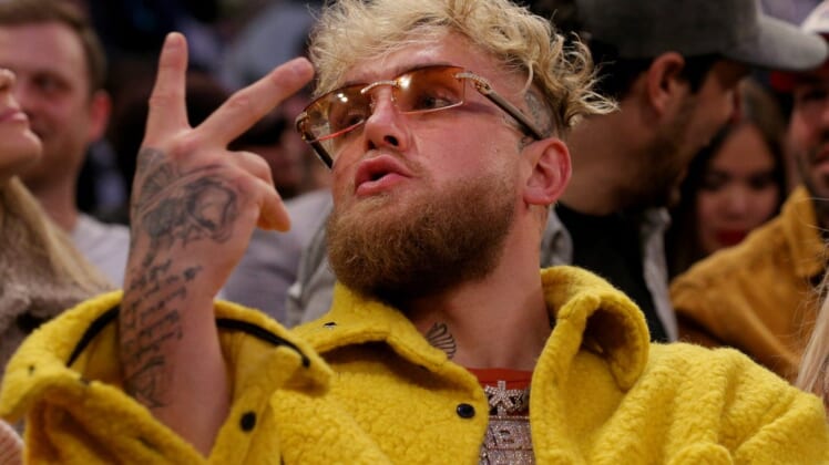 Feb 2, 2022; New York, New York, USA; American boxer Jake Paul gestures at a fan during the third quarter between the New York Knicks and the Memphis Grizzlies at Madison Square Garden. Mandatory Credit: Brad Penner-USA TODAY Sports