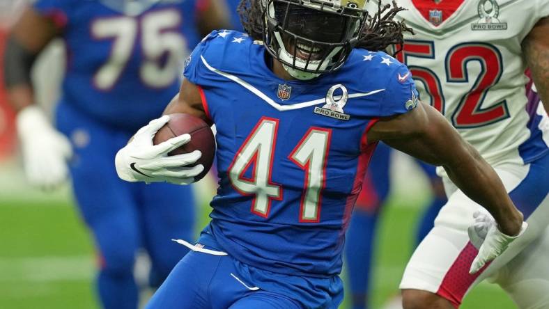 Feb 6, 2022; Paradise, Nevada, USA; NFC running back Alvin Kamara of the New Orleans Saints runs with the ball against the AFC during the Pro Bowl football game at Allegiant Stadium. Mandatory Credit: Stephen R. Sylvanie-USA TODAY Sports