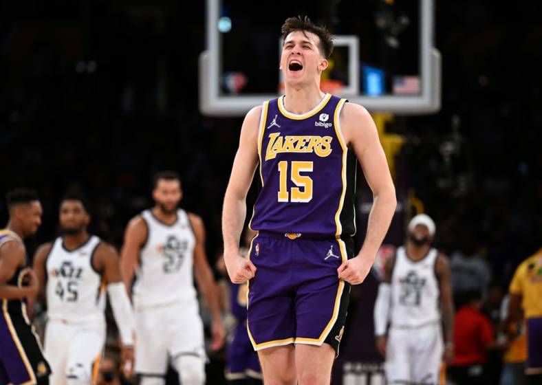 Feb 16, 2022; Los Angeles, California, USA; Los Angeles Lakers guard Austin Reaves (15) celebrates after making a three-point basket in the final seconds against the Utah Jazz at Crypto.com Arena. Mandatory Credit: Jayne Kamin-Oncea-USA TODAY Sports