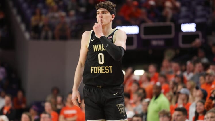 Feb 23, 2022; Clemson, South Carolina, USA; Wake Forest Demon Deacons forward Jake LaRavia (0) reacts after making a three point shot against the Clemson Tigers during the second half at Littlejohn Coliseum. Mandatory Credit: Dawson Powers-USA TODAY Sports