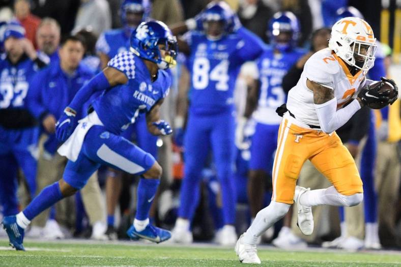Tennessee defensive back Alontae Taylor (2) intercepts a pass intended for Kentucky wide receiver Wan'Dale Robinson (1) and runs the ball for a touchdown during an SEC football game between Tennessee and Kentucky at Kroger Field in Lexington, Ky. on Saturday, Nov. 6, 2021.

Kns Tennessee Kentucky Football