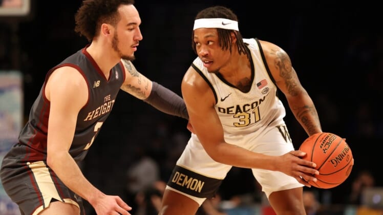 Mar 9, 2022; Brooklyn, NY, USA; Wake Forest Demon Deacons guard Alondes Williams (31) controls the ball against Boston College Eagles guard Jaeden Zackery (3) during the first half at Barclays Center. Mandatory Credit: Brad Penner-USA TODAY Sports