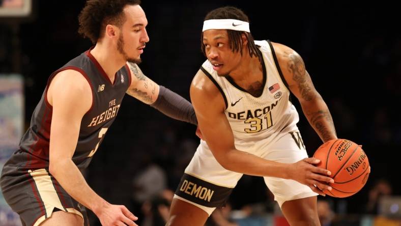 Mar 9, 2022; Brooklyn, NY, USA; Wake Forest Demon Deacons guard Alondes Williams (31) controls the ball against Boston College Eagles guard Jaeden Zackery (3) during the first half at Barclays Center. Mandatory Credit: Brad Penner-USA TODAY Sports