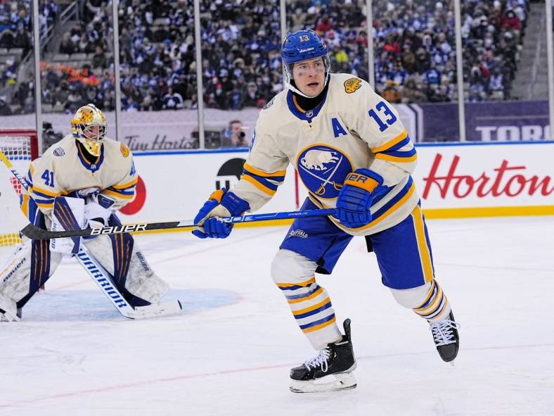 Mar 13, 2022; Hamilton, Ontario, CAN; Buffalo Sabres defenseman Mark Pysyk (13) skates against the Toronto Maple Leafs during the third period in the 2022 Heritage Classic ice hockey game at Tim Hortons Field. Mandatory Credit: John E. Sokolowski-USA TODAY Sports