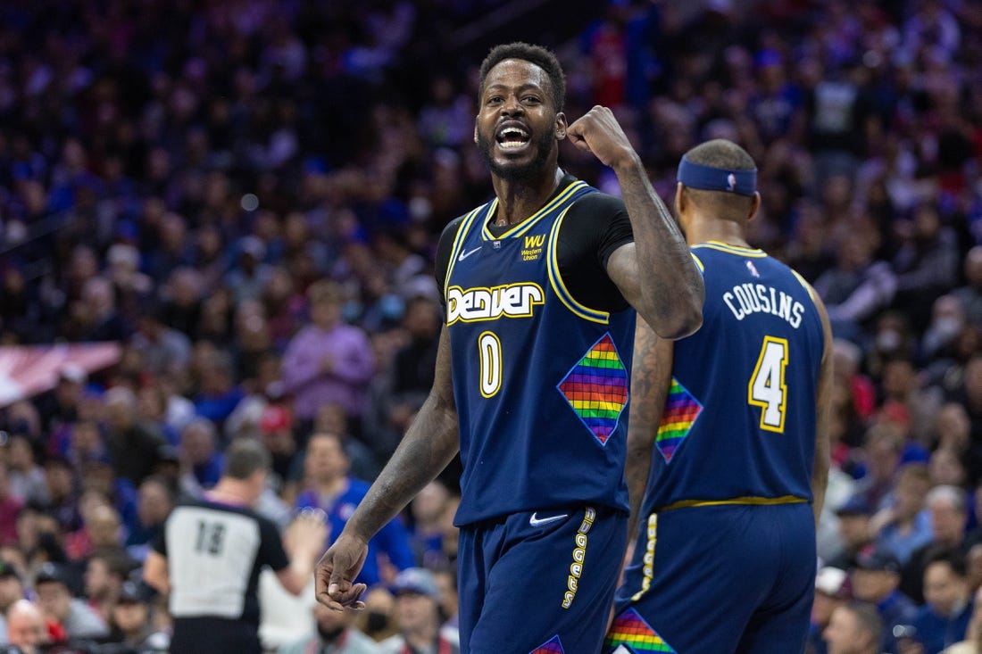 Mar 14, 2022; Philadelphia, Pennsylvania, USA; Denver Nuggets forward JaMychal Green (0) reacts to a fan during the fourth quarter against the Philadelphia 76ers at Wells Fargo Center. Mandatory Credit: Bill Streicher-USA TODAY Sports
