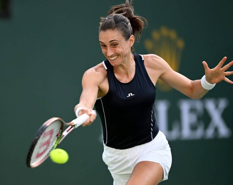 Mar 16, 2022; Indian Wells, CA, USA;  Petra Martic (CRO) hits a shot in her quarterfinal match against Simona Halep (ROM) at the BNP Paribas Open at the Indian Wells Tennis Garden. Mandatory Credit: Jayne Kamin-Oncea-USA TODAY Sports