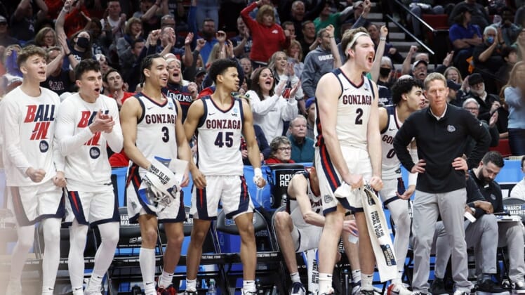 Mar 17, 2022; Portland, OR, USA; Gonzaga Bulldogs forward Drew Timme (2) and guard Rasir Bolton (45) and guard Andrew Nembhard (3) react on the bench in the second half against the Georgia State Panthers as head coach Mark Few looks on during the first round of the 2022 NCAA Tournament at Moda Center. Mandatory Credit: Soobum Im-USA TODAY Sports