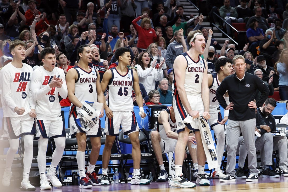 Mar 17, 2022; Portland, OR, USA; Gonzaga Bulldogs forward Drew Timme (2) and guard Rasir Bolton (45) and guard Andrew Nembhard (3) react on the bench in the second half against the Georgia State Panthers as head coach Mark Few looks on during the first round of the 2022 NCAA Tournament at Moda Center. Mandatory Credit: Soobum Im-USA TODAY Sports