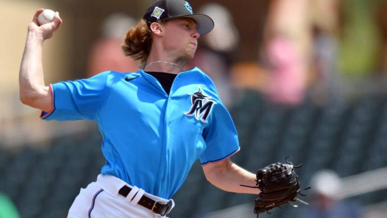 Mar 21, 2022; Jupiter, Florida, USA; Miami Marlins pitcher Max Meyer (63) pitches against the New York Mets in the fourth inning during a spring training game at Roger Dean Stadium. Mandatory Credit: Jim Rassol-USA TODAY Sports