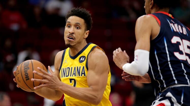 Mar 18, 2022; Houston, Texas, USA; Indiana Pacers guard Malcolm Brogdon (7) drives to the basket against the Houston Rockets during the game at Toyota Center. Mandatory Credit: Erik Williams-USA TODAY Sports