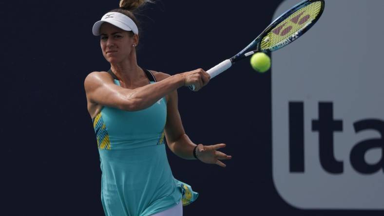 Mar 24, 2022; Miami Gardens, FL, USA; Anna Bondar (HUN) hits a forehand against Danielle Collins (USA) (not pictured) in a second round women's singles match in the Miami Open at Hard Rock Stadium. Mandatory Credit: Geoff Burke-USA TODAY Sports