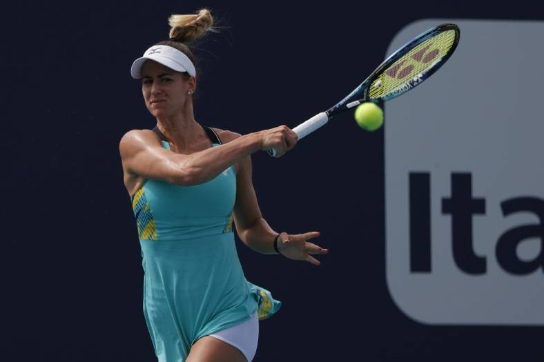 Mar 24, 2022; Miami Gardens, FL, USA; Anna Bondar (HUN) hits a forehand against Danielle Collins (USA) (not pictured) in a second round women's singles match in the Miami Open at Hard Rock Stadium. Mandatory Credit: Geoff Burke-USA TODAY Sports