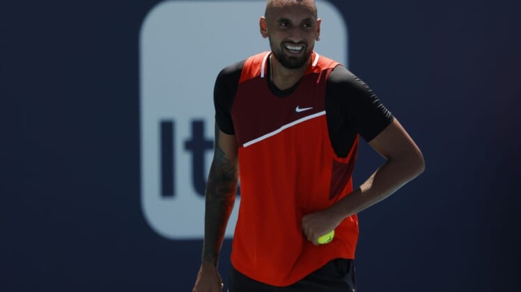 Mar 29, 2022; Miami Gardens, FL, USA; Nick Kyrgios (AUS) smiles between points against Jannik Sinner (ITA)(not pictured) in a fourth round men's singles match in the Miami Open at Hard Rock Stadium. Mandatory Credit: Geoff Burke-USA TODAY Sports